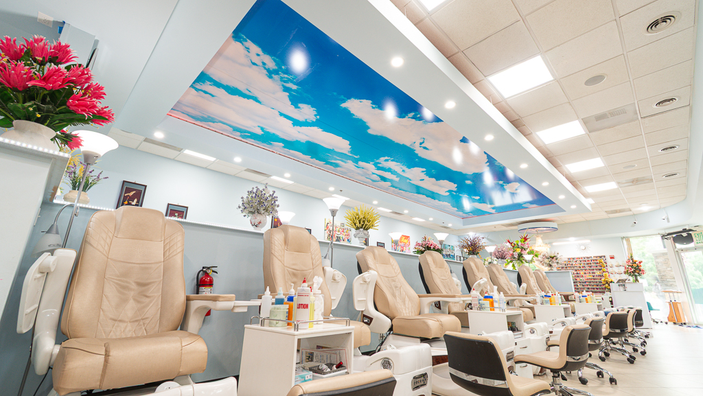 Pedicure lounge under the blue-sky ceiling at NK Nails & Spa